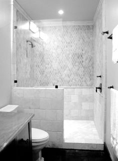 black and white photograph of a bathroom with shower