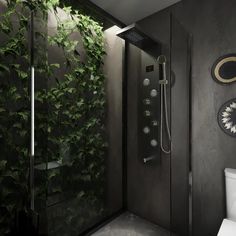 a bathroom with plants on the wall and a toilet in the shower stall next to it