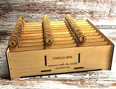 a wooden box filled with lots of keys