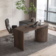 an office desk with a laptop on it in front of a large window and a potted plant