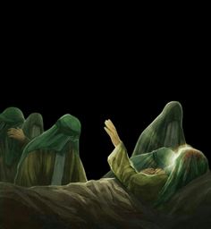 three women in green robes are laying on the ground with their hands up and one is reading