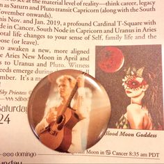 a magazine article with an image of a woman holding a guitar