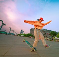 a man riding a skateboard on top of cement