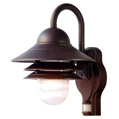 an outdoor wall light with a black shade on the top and white back ground, isolated against a white background