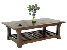 a wooden table with a flower vase on top