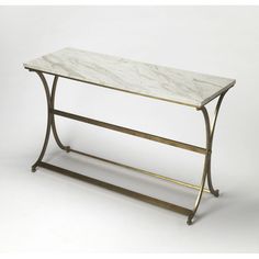 a marble topped console table with gold metal legs and a white marble top, against a plain background