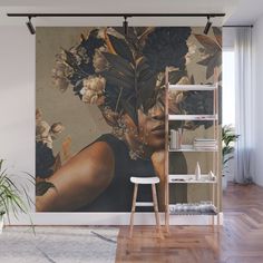 a woman with flowers on her head wall mural