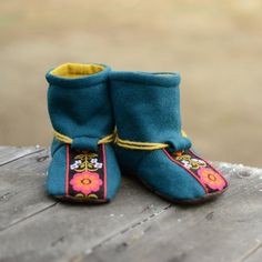 Sew these delightfully happy boots to keep little feet snug and warm this winter.  These simple-to-sew yet impressive boots are carefully designed to be both practical and adorable -  like a big hug for little feet!  Sizes:  Baby 1-5, Child 6-13, Youth 1-4  (17 sizes from newborn to approx age 9){ PDF Pattern Features }- Leather/suede can be used for the sole- Fully lined - no scratchy exposed seams here!- External elastic - simply re-tie as they grow- BONUS pattern piece for a longer boot which Winter Booties With Soft Sole And Closed Toe, Comfortable Round Toe Booties For Playtime, Cute Non-slip Winter Boots, Winter Booties With Soft Sole And Round Toe, Winter Round Toe Booties With Soft Sole, Winter Playtime Booties With Soft Sole, Warm Winter Booties With Round Toe, Comfortable Winter Booties With Soft Sole, Cute Boots With Soft Sole And Closed Toe