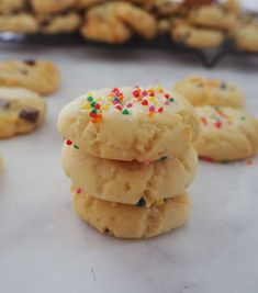 a stack of cookies with sprinkles and chocolate chips