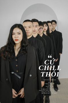 a group of people standing next to each other in front of a poster that says ou chul thoi