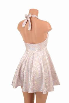 "This item is made to order, please read all the way through the listing before purchasing! This flowy dress is made of pink & silver round scale holographic spandex. The halter top is darted and ties behind the neck, the hemline is circle cut. Length: 17\" measured from the waist to the hemline. We can create this dress from any other fabric in our shop, just ask! Womens Sizing (See below for instructions on where measurements should be taken) XXS: Bust 29\"-30\" / Waist 22\"-23\" / Hips 30 Summer Fitted Sequin Dress With Shimmer, Fitted Sequin Summer Dress With Shimmer, Fitted Sequin Dress With Shimmer For Summer, Spring Fitted Iridescent Mini Dress, Fitted Iridescent Mini Dress For Spring, Spring Iridescent Fitted Mini Dress, Metallic Fitted Sequin Dress For Spring, Metallic Fitted Sequin Dress For Prom, Pink Fitted Sequin Backless Dress