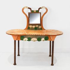 an orange and green table with a mirror on it