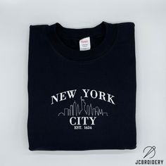 "New York City custom embroidered crewneck sweatshirt. Show love for your favorite city in the world! These sweatshirts are embroidered with a trending design showcasing famous cities. Also available on a white hooded sweatshirt, check the \"cities\" tab for more options! All material and options are embroidered on high quality HANES products (see below).  This item is made to order so allow 1-2 weeks processing time plus the additional time for shipping. All items and orders over $35 ship free to the U.S.  Ensure you choose the correct color, item style, and item size when checking out. If you have any questions send me a message so I can ensure you receive the right product. Hanes Products: -Crewneck: 9.7 oz, 90% cotton, 10% polyester (style F260) -hoodless, low pill, double-needle cover New York Crewneck Outfit, Urban Hoodie With Embroidered Logo And Crew Neck, Crew Neck Hoodie With Embroidered Text For Streetwear, Streetwear Crew Hoodie With Embroidered Text, Streetwear Crew Sweatshirt With Custom Embroidery, Black Embroidered Logo Crew Neck Sweatshirt, Nyc Hoodie, New York City Sweatshirt, White Hooded Sweatshirt