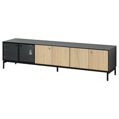 an entertainment center with two doors and three drawers on each side, in black and oak