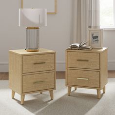 two nightstands side by side, one with a lamp and the other with a book on top