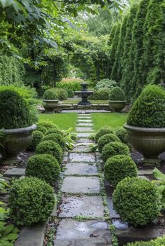 a stone path between two large planters