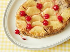 a piece of pineapple pie on a plate with cherries