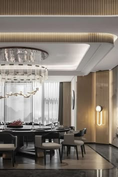 an elegant dining room with chandelier and round table surrounded by chairs in the center