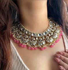 Adorn yourself in timeless elegance with this exquisite pink Kundan and zircon necklace set, perfect for weddings and special occasions. Crafted with meticulous attention to detail, the set features delicate  hues reminiscent of Pakistani and Punjabi traditions, with a touch of Bollywood glamour. Complete with matching earrings and a stunning maangtika, this Indian Kundan ensemble effortlessly captures the essence of sophistication and grace. Measurements:   Necklace Length-14" Necklace Width- 12" Earring Length-3" Each earring weighs: 30 gms   Maangtika Length- 7" Maangtika Width- 1.5" Kundan Bridal Jewellery, Punjabi Jewellery, Bollywood Glamour, Bridal Jewelry Necklace, Zircon Necklace, Jewellery Indian, Jewellery Necklace, Indian Clothes, Bridal Jewellery