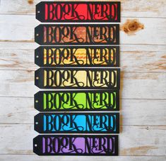 the book nerd name tags have been cut out to look like they are in different colors