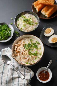 bowls of rice and other foods on a table