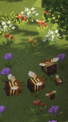 an image of some flowers and boxes in the middle of a grass field with trees