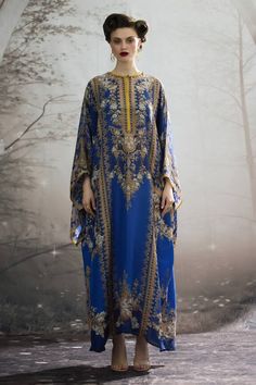 Blue silk long kaftan with all over regal floral prints and narrow yellow panel work. - Aza Fashions Traditional Blue Floor-length Kaftan, Elegant Maxi Kaftan With Printed Motifs, Royal Blue Long Kaftan, Silk Digital Print Kaftan For Eid, Elegant Blue Kaftan With Dabka Details, Blue Traditional Maxi Length Kaftan, Traditional Blue Maxi Length Kaftan, Blue Tunic Thobe For Eid, Royal Blue Kaftan For Eid