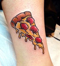 a slice of pizza with cherries on it is sitting on the leg of a woman