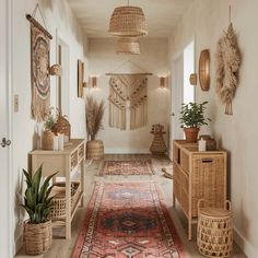 the hallway is decorated with wicker baskets and woven wall hangings, along with plants