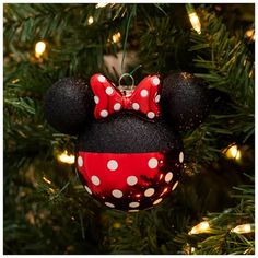 a mickey mouse ornament hanging from a christmas tree