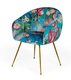 a colorful chair with gold legs and flowers on the armrests, sitting in front of a white background