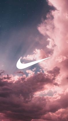 the sky is filled with clouds and a white nike logo