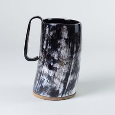 a black and white coffee mug on a white background