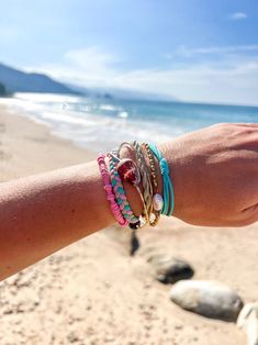 Ocean/Kiwi/Bubble gum combo Set of 12 bands Multi functional as a bracelet and hair tie Holds hair securely without snagging Helps save the ocean and coastlines. Save The Ocean, Sand Candles, Short Scarves, Sand Cloud, Flannel Sweatshirt, Bracelet Pack, Swimwear Store, Beach Beauty, A Bracelet