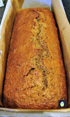 a loaf of banana bread in a cardboard box