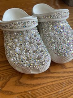 Wedding, personalized crocs. Gorgeously made with high quality crystals, hand placed and made to order! Can add initials or wedding date on the back as well. Make sure you include size and personalization when ordering! Happy to answer any questions Rhinestone Crocs Shoes, Wedding Crocs For Bride, Bling Crocs Shoes Diy, Wedding Crocs Shoes, Pearl Crocs, Rhinestone Crocs Shoes Diy, Bride Crocs, Bridal Crocs, Customized Crocs Shoes