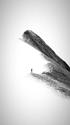 a person standing on top of a large hill