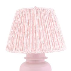 a pink table lamp on a white background