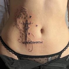 a woman with a tattoo on her stomach