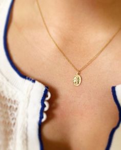 Saint Christopher is meant to keep you safe on your journeys whether that's a trip you've got planned or your journey through life.  This petite pendant measures 9 mm x 12 mm and is available on 16 inch, 18 inch (standard length) or 20 inch chain (for custom lengths, please inquire).  This necklace is 14K gold-filled to American standard so it's shower safe and great for everyday wear. Makes a beautiful gift to mark a special milestone.  Model is also wearing our 20mm 14K gold-filled hoops (also St Christopher Necklace The Catholic Company, Gold St Christopher Necklace, Spiritual Gold Jewelry For Everyday Use, Personalized Gold Jewelry For Everyday Use, Necklace Drawing, St Christopher Necklace, Blue Choker, Gold Heart Locket, Bohemian Style Jewelry