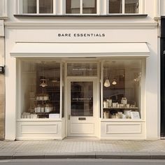 a store front with the door open on a city street