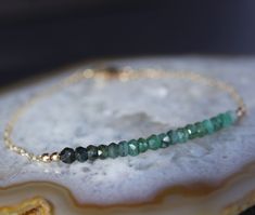 - THIS IS VERY SKINNY DAINTY BRACELET. THE PHOTOS ARE ENLARGED. - Made with gorgeous all natural raw emerald. - This is available in sterling silver or gold filled - Emerald beads measure around 3 mm. Total length of the beaded bar section is about 1.75 inches. - All bracelets are made to order. Please select the wrist size during checkout. If you prefer to give me a bracelet length instead, please leave me a note during check out. - If your wrist size is in between the listed options or if you Herkimer Diamond Earrings, Herkimer Diamond Necklace, Multi Wrap Bracelet, Raw Emerald, Emerald Bracelet, Emerald Bead, Pacific Palisades, Dainty Bracelet, Chunky Jewelry