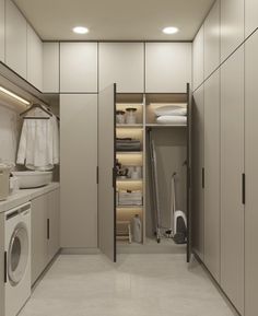 a washer and dryer in a small room with lots of closet space between them