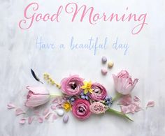 a bouquet of pink flowers sitting on top of a white sheet with the words, good morning have a beautiful day