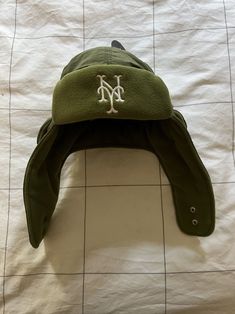 Aime Leon Dore ALD / New Era New York Mets Trapper Hat in Olive Size Large FW24. Brand new with tags. Free and fast shipping. 100% authentic guaranteed. • Olive trapper hat • Embroidered New York Mets logo at front • Embroidered Aimé Leon Dore logo at side • Cotton exterior with sherpa lining • Adjustable snap closure • 80% Cotton, 20% Shearling • Hand wash • Made in Vietnam • Fits true to size. Order your normal size. The average mens head size is a L. The average womens head size is a M. Vietnam Fits, New York Mets Logo, Mets Logo, Leon Dore, Trapper Hat, Aime Leon Dore, Trapper Hats, New York Mets, Snap Closure