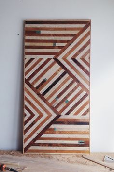 a piece of wood that has been made into a wall hanging on the side of a wall