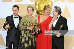 three men and two women posing with their oscars for best supporting actress in a motion