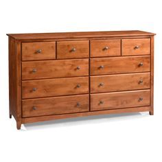 a wooden dresser with many drawers and knobs on the bottom drawer, against a white background