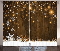 the curtains are decorated with lights and snowflakes