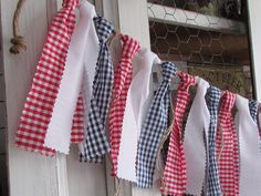 red, white and blue gingham ribbon hanging from a door